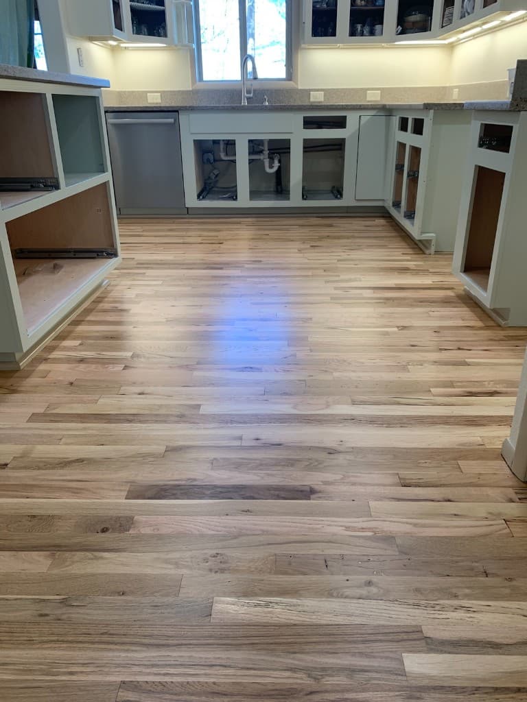 Kitchen with restored hardwood flooring