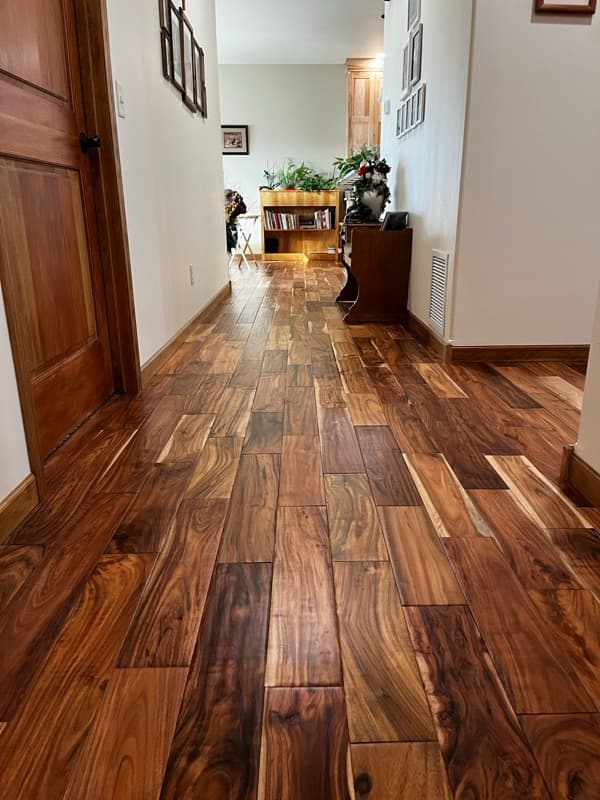 Custom walnut flooring installation in hallway